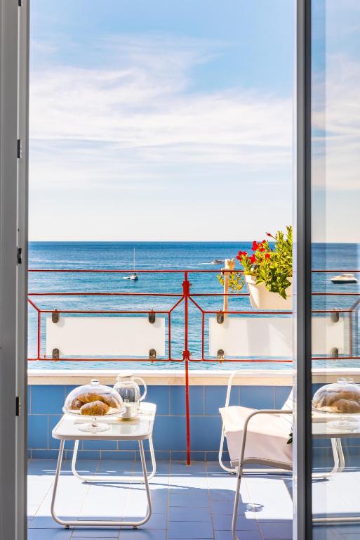 a view of the ocean from the balcony of a cruise ship at Blumare Amalfi Coast in Maiori