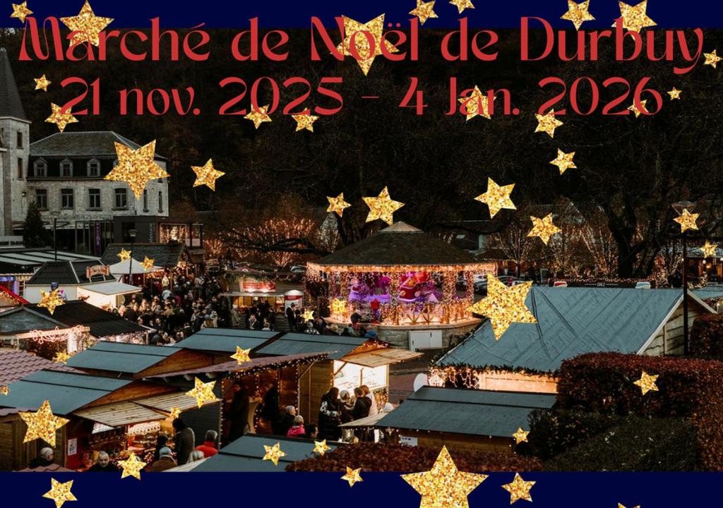 an overhead view of a christmas market with christmas lights at Entre parenthèses in Barvaux