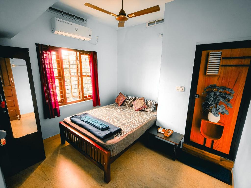 Postel nebo postele na pokoji v ubytování Pranavam Beach Homestay