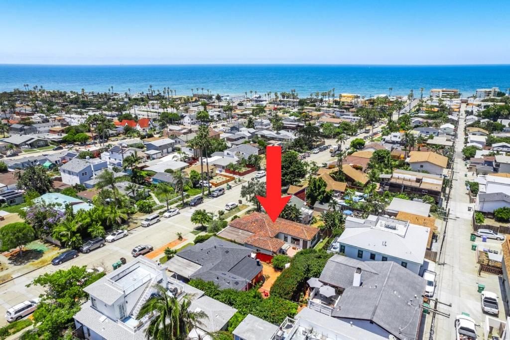 an aerial view of a city with a red arrow on it at 2BR-2 mins to Ocean-Sleeps 8-Pets in San Diego