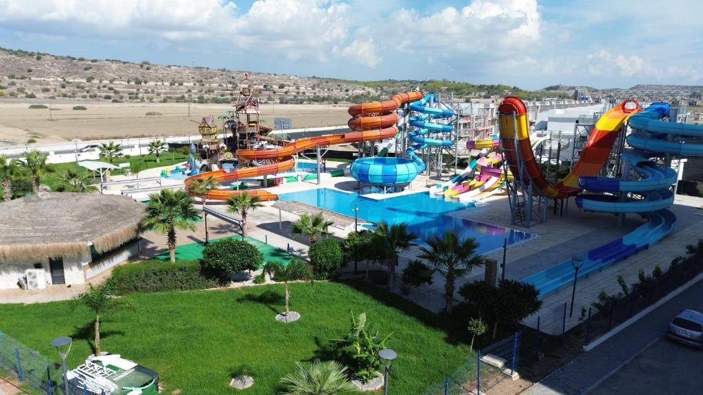 a water park with a bunch of water slides at Caesar Blue Resort & Spa apartment D10 in Kalecik