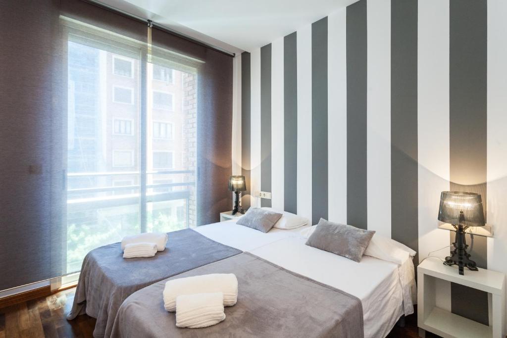 Posteľ alebo postele v izbe v ubytovaní Baron Suites
