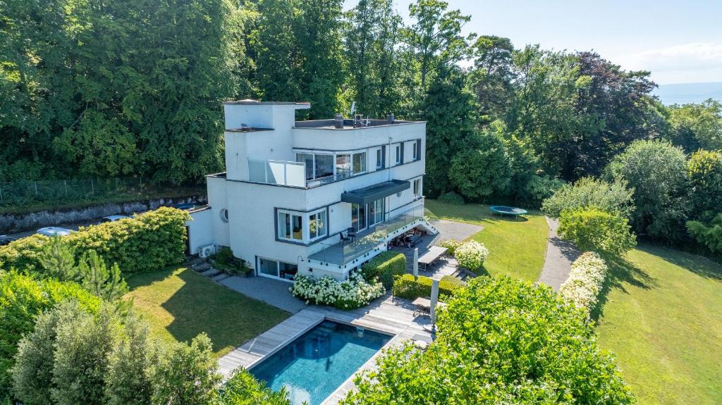 an aerial view of a house with a swimming pool at Villa heart of Evian swimming pool in Évian-les-Bains