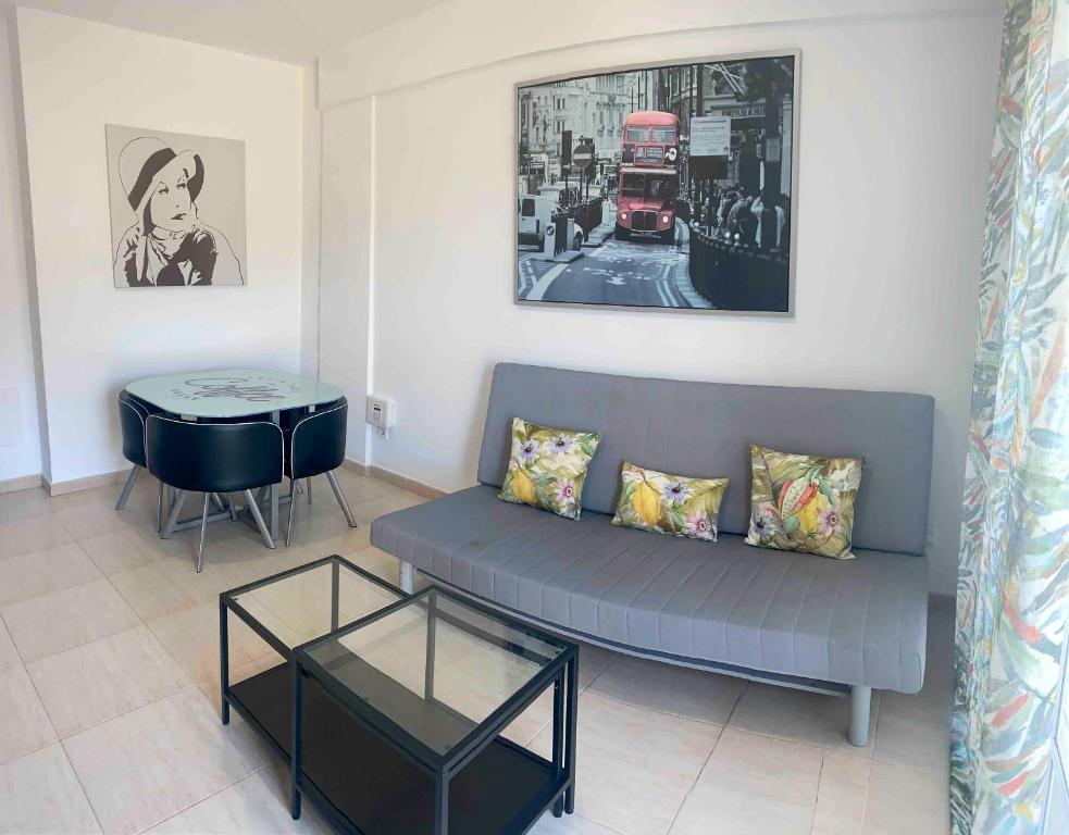 a living room with a couch and a table at Ático en San Andres in San Andrés