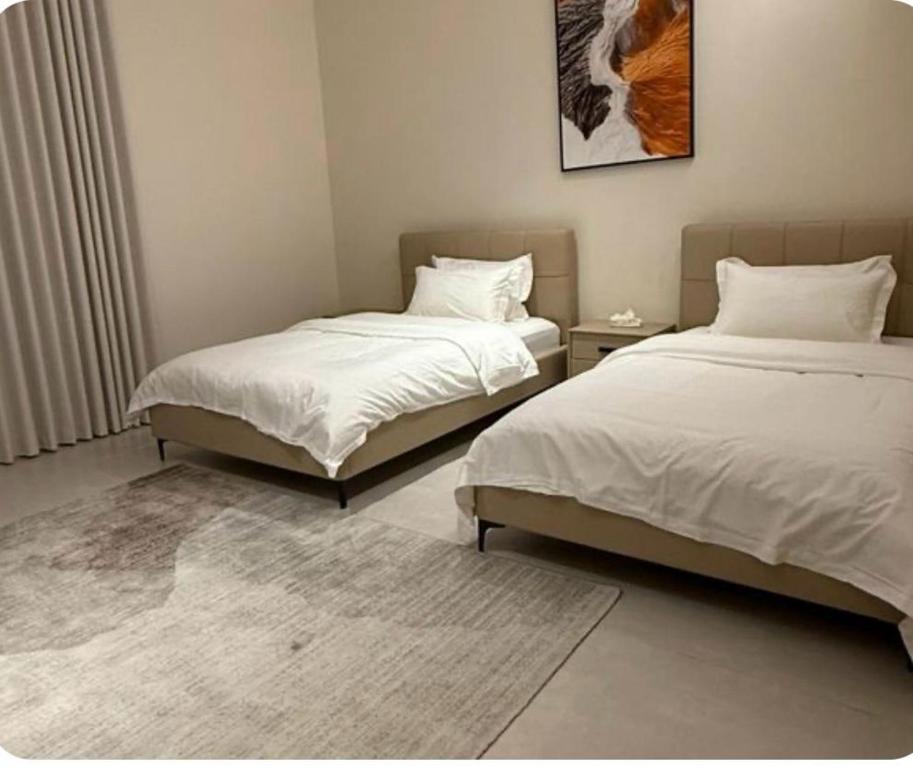 Postel nebo postele na pokoji v ubytování شقة فاخرة بغرفتين نوم وصالة