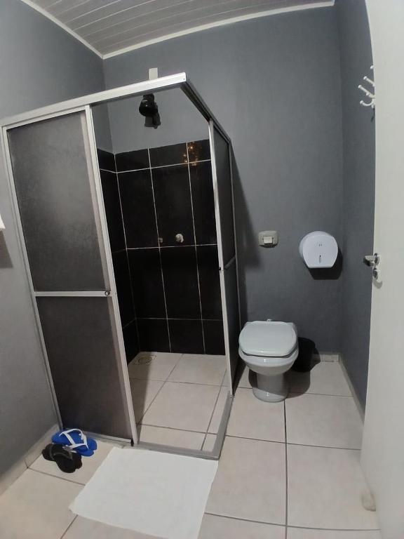 a bathroom with a shower and a toilet at Motel A 2 in Criciúma