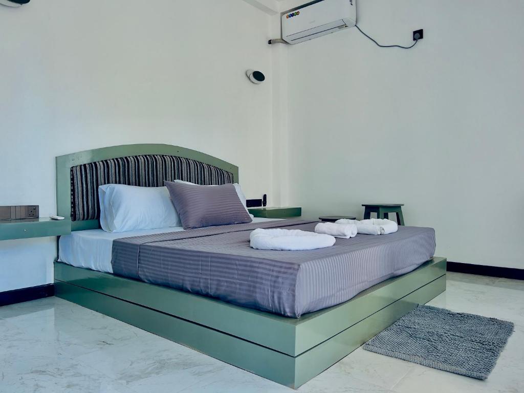 Postel nebo postele na pokoji v ubytování K T Resort - Ahangama