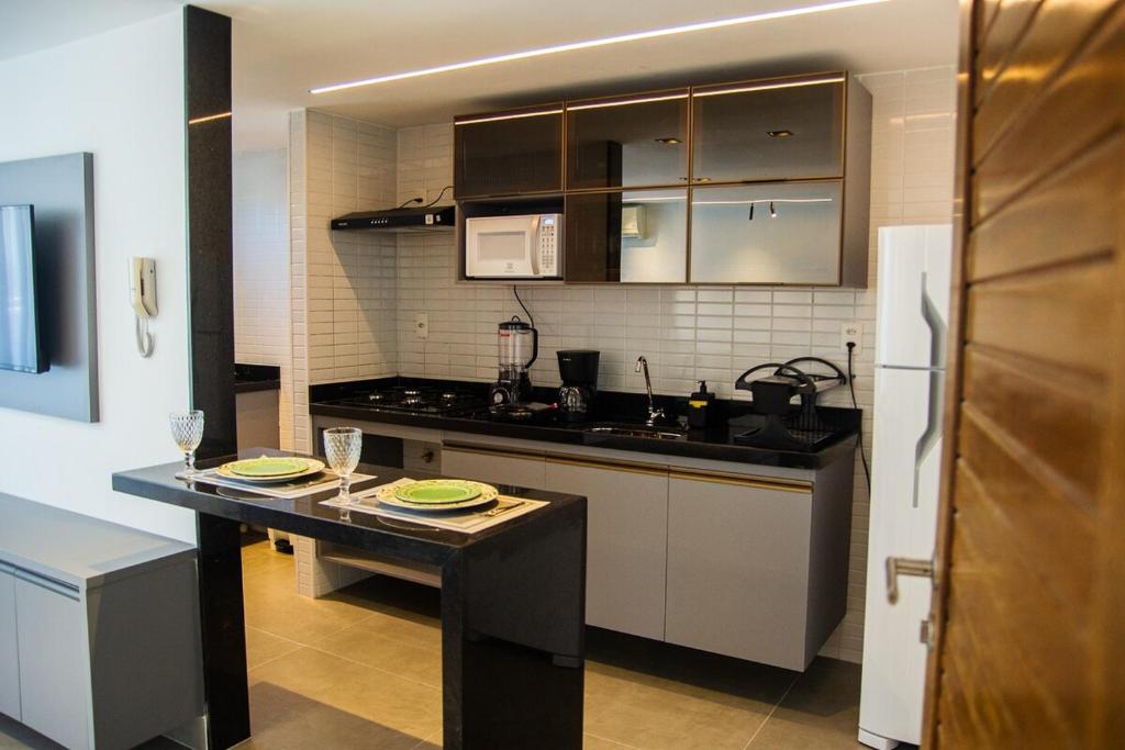 Køkken eller tekøkken på Residencial Jardins do Atlântico