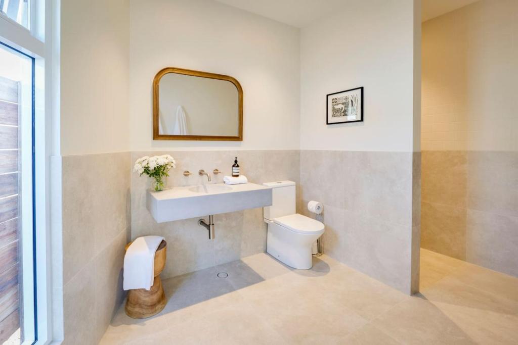 a bathroom with a sink and a toilet at Ideally Located Modern Studio Apartment in Dunsborough