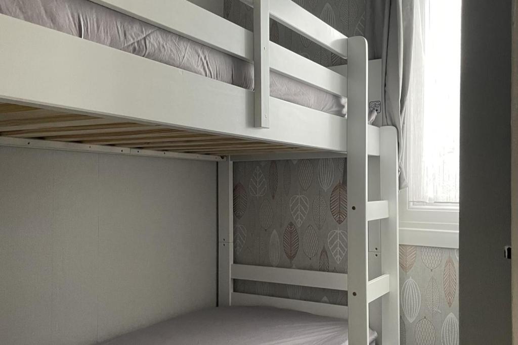 a white bunk bed in a room with a window at 2Bed Chalet Sleeps 4- Garden Balcony Pets Beach in Bridlington