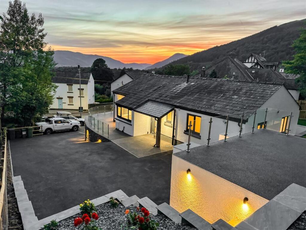 an aerial view of a house with a parking lot at Jaytrees, Keswick - Luxury bungalow with hot tub in Keswick