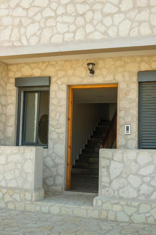 a stairway leading to a building with a door at Dar Iziki Separate Apartments in Sidi Kaouki