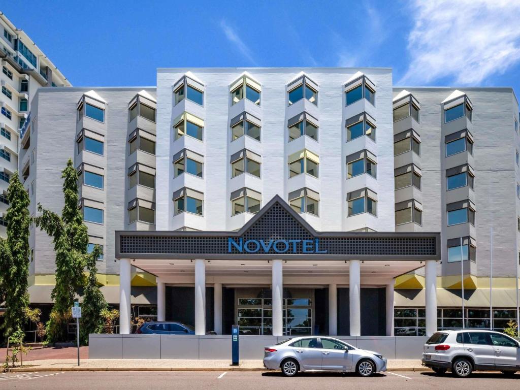 a hotel with cars parked in front of it at Novotel Darwin CBD in Darwin