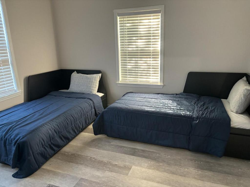 Ένα ή περισσότερα κρεβάτια σε δωμάτιο στο Welcome to this Modern listing in the Heart Of ATL