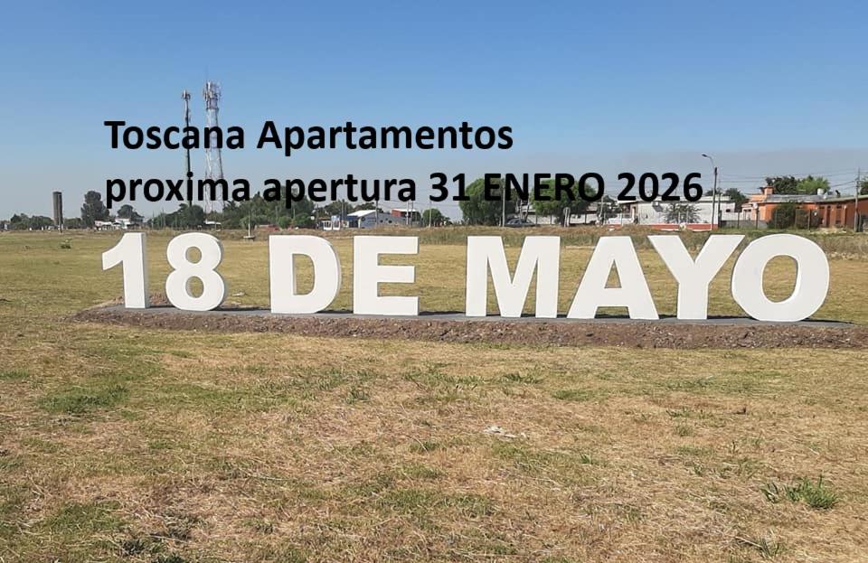 a sign for at Toscana Apartamentos 