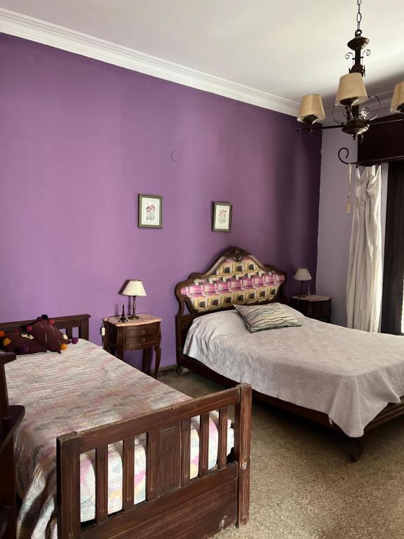 Ένα ή περισσότερα κρεβάτια σε δωμάτιο στο Dormitorio en casa de familia