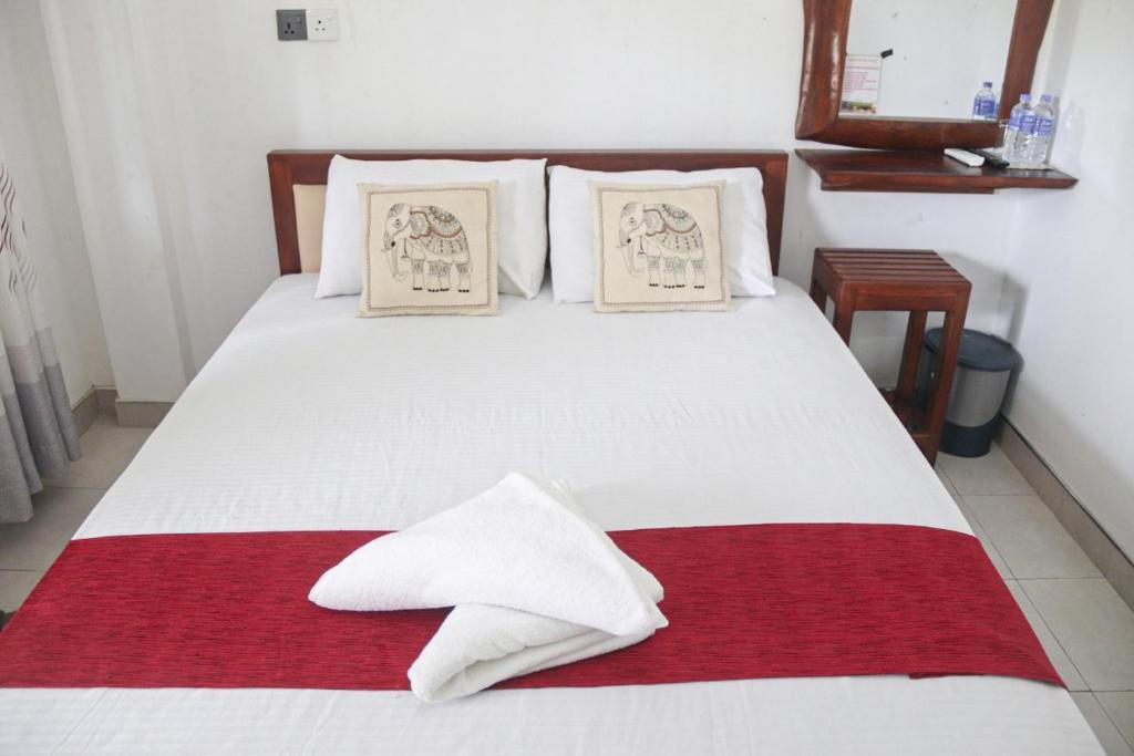 Postel nebo postele na pokoji v ubytování Ora Safari Resort