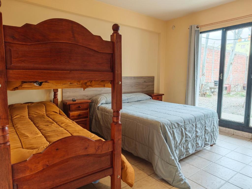 Postel nebo postele na pokoji v ubytování Keóken - Frente al Hiper Tehuelche