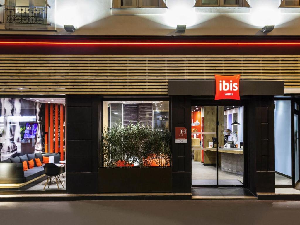 a store front with a sign in front of it at ibis Paris Gare De L'Est TGV in Paris