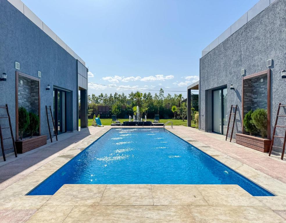 a swimming pool in the backyard of a house at Villa Ramona in Marrakech