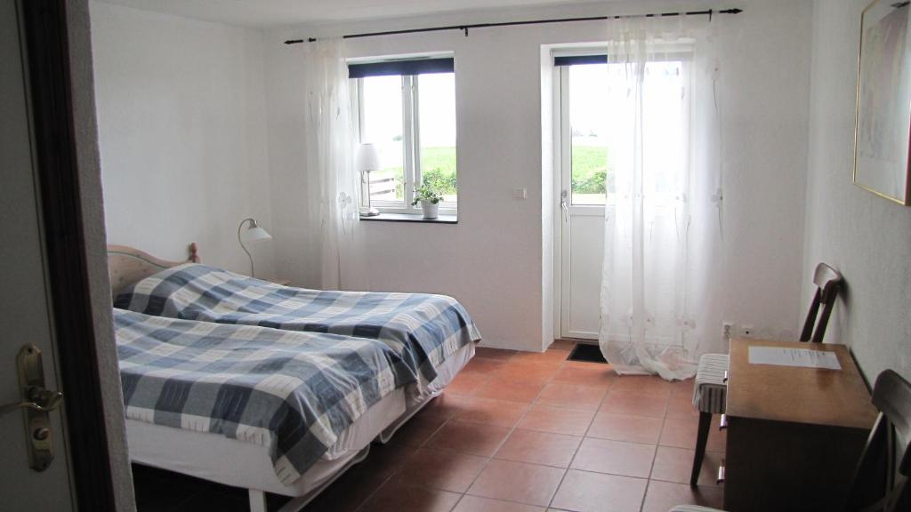 Postel nebo postele na pokoji v ubytování Skönadal B&B