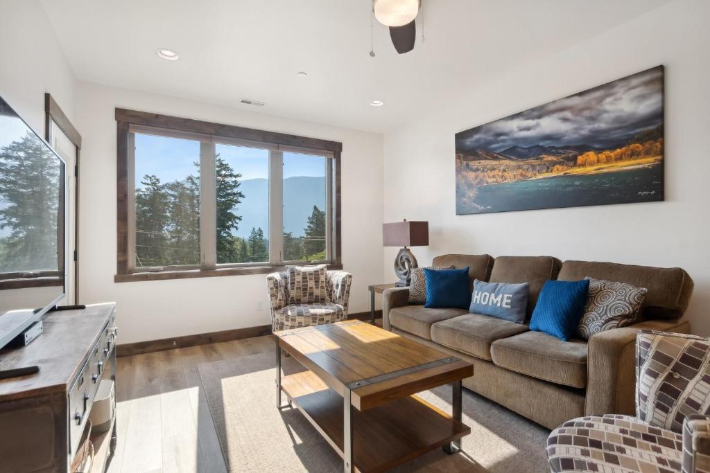 a living room with a couch and a table at Columbia Crest 301 in Columbia Falls