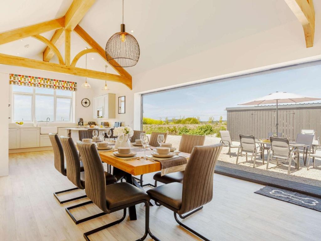 a dining room with a table and chairs at 3 Bed in Porthtowan 88102 in Redruth
