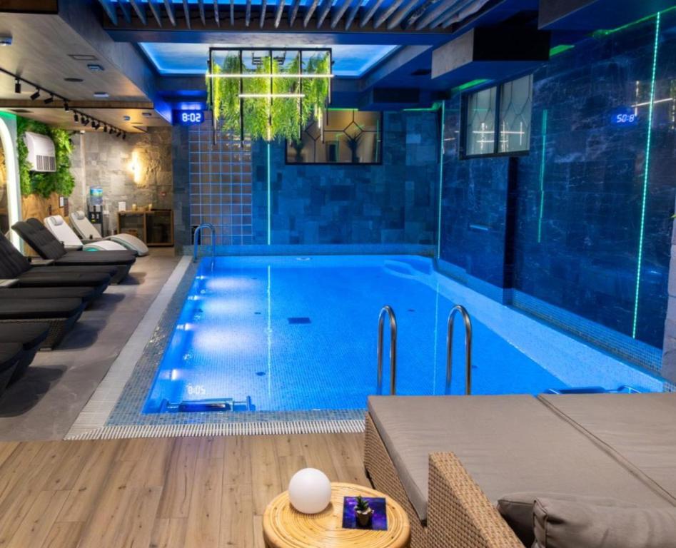 a large swimming pool with a chandelier at Aqua Lux apartmani in Vršac