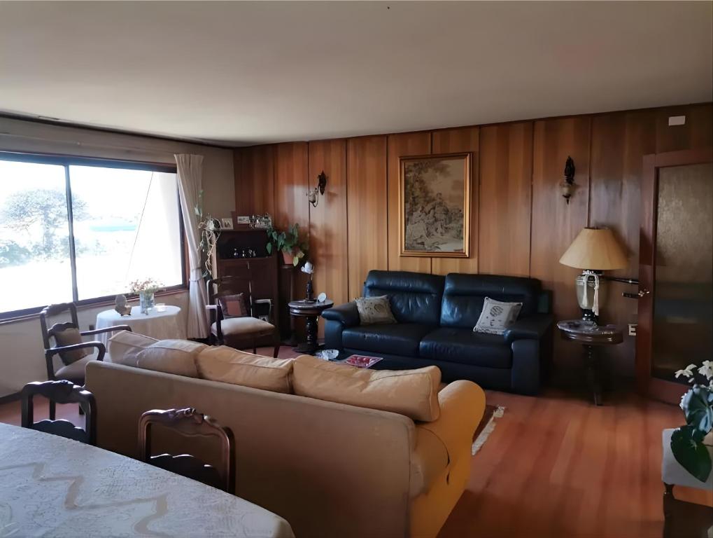 Posezení v ubytování Hostal Edificio Kuramochi