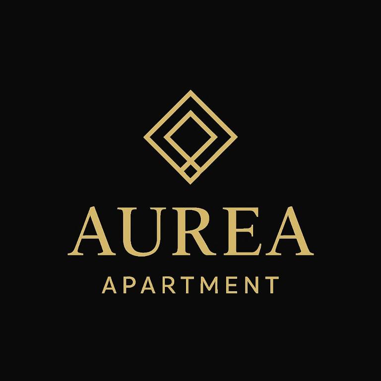 Et logo, certifikat, skilt eller en pris der bliver vist frem på AUREA Apartment