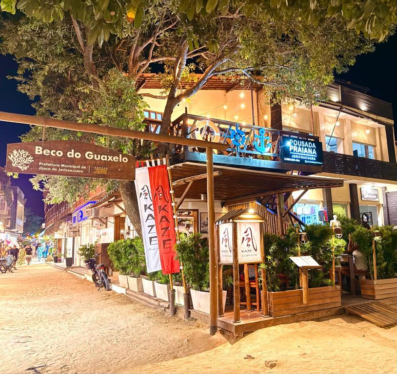 a building with a sign that reads boro do cuoco at Pousada Praiana Jericoacora in Jericoacoara