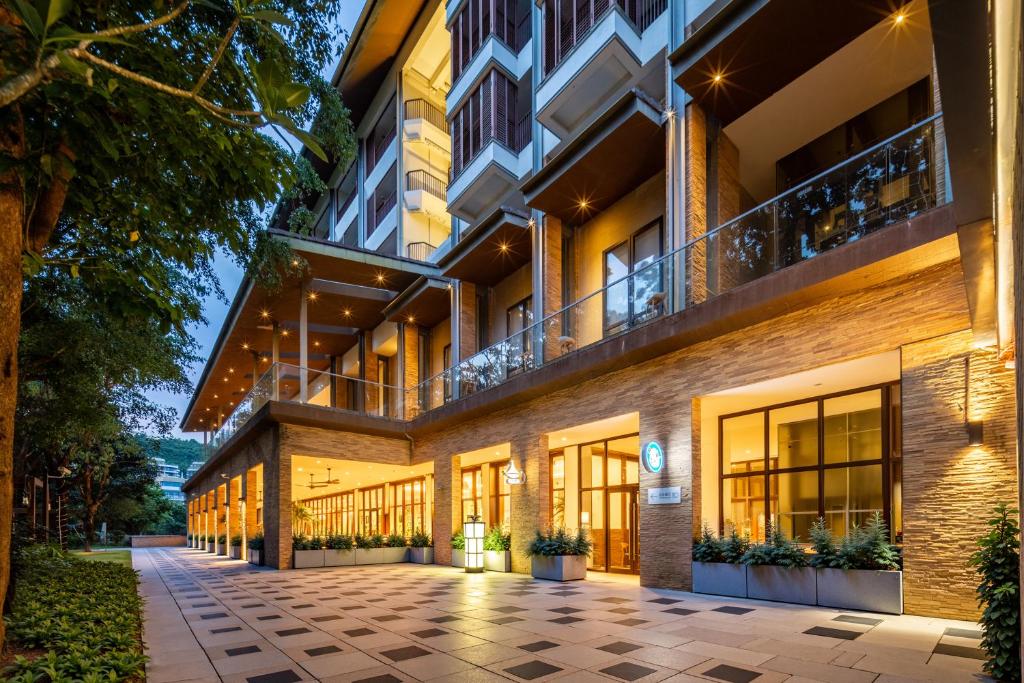 an exterior view of a building with a courtyard at The Yun Collection Sanya in Sanya