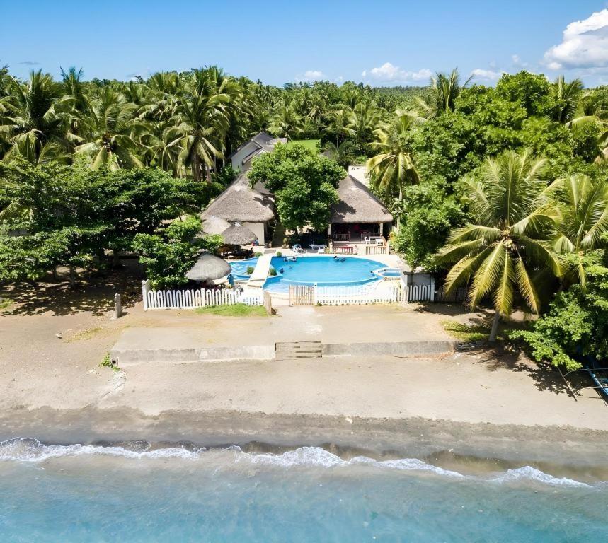 an aerial view of a resort with a swimming pool at AGM Beachfront Resort in Donsol