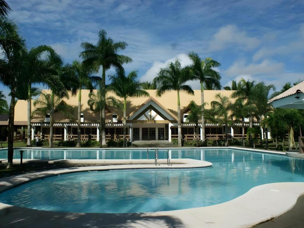 a large swimming pool in front of a resort at Pineapple Island Resort in Badas