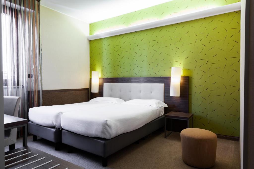 Postel nebo postele na pokoji v ubytování Hotel Des Etrangers