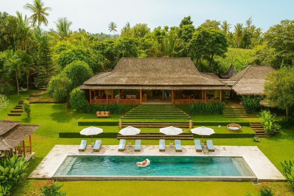 an aerial view of a resort with a swimming pool at Barefoot in the Heart in Krambitan