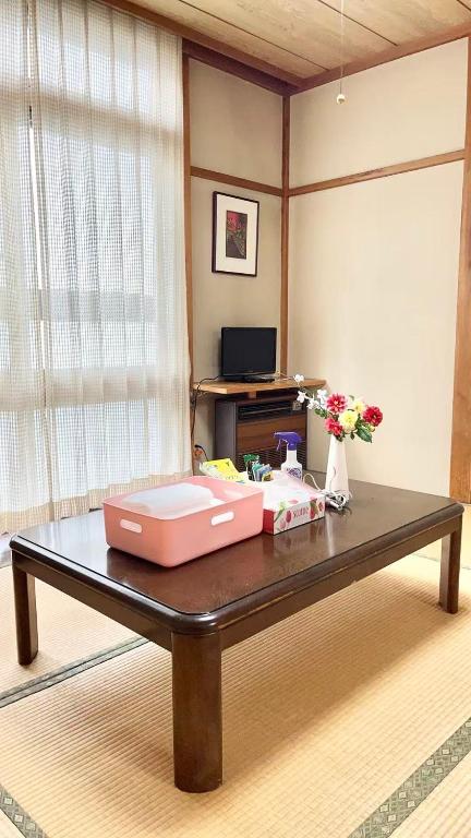 a table with two boxes on top of it at 苗場ウッドインだいまる in Yuzawa