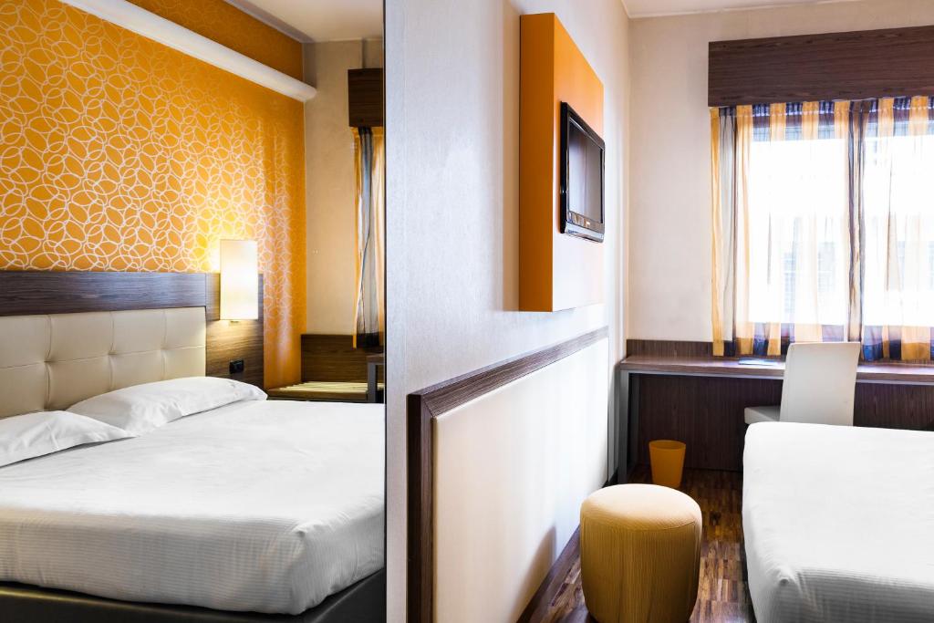 Postel nebo postele na pokoji v ubytování Hotel Des Etrangers