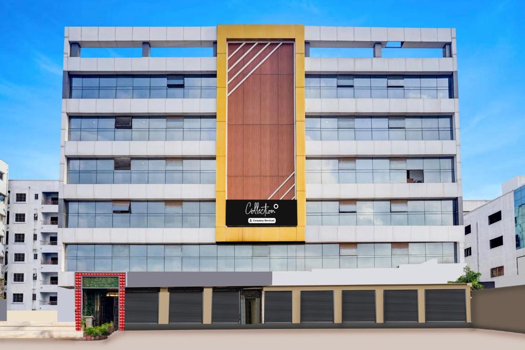a building with a sign on the side of it at Super Collection O Manjari - Mundhwa Road Formerly 7 Treats in Mundhwa