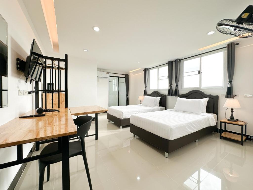Ένα ή περισσότερα κρεβάτια σε δωμάτιο στο Wises Hotel