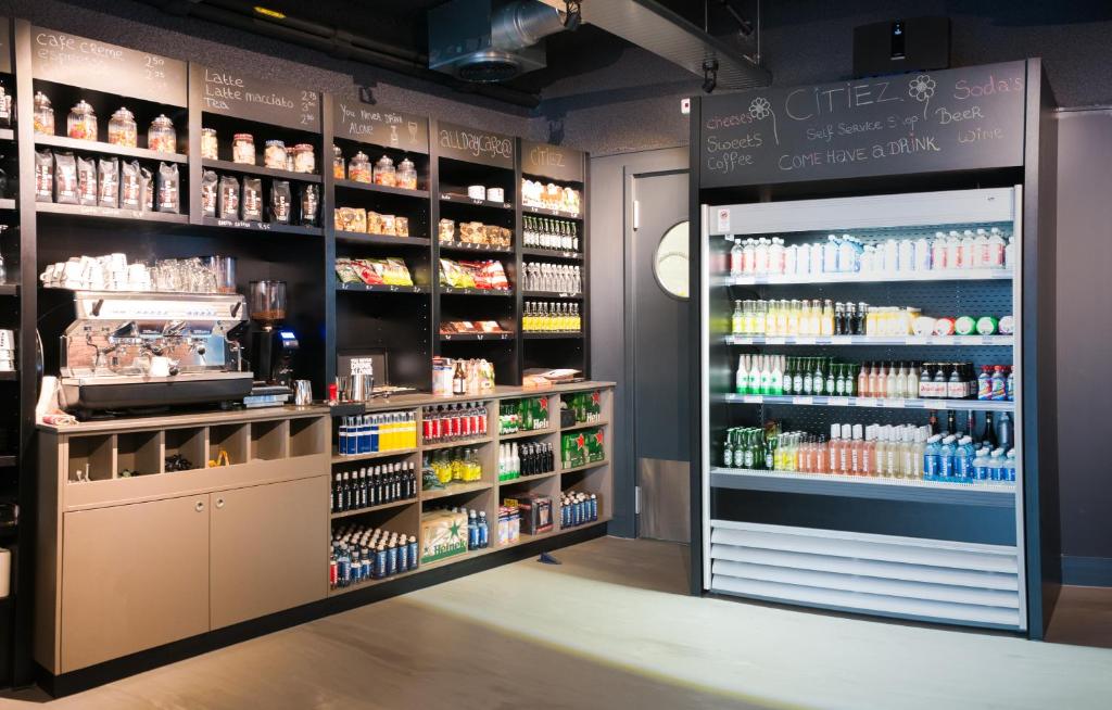 a grocery store aisle with a lot of products at Citiez Hotel Amsterdam in Amsterdam