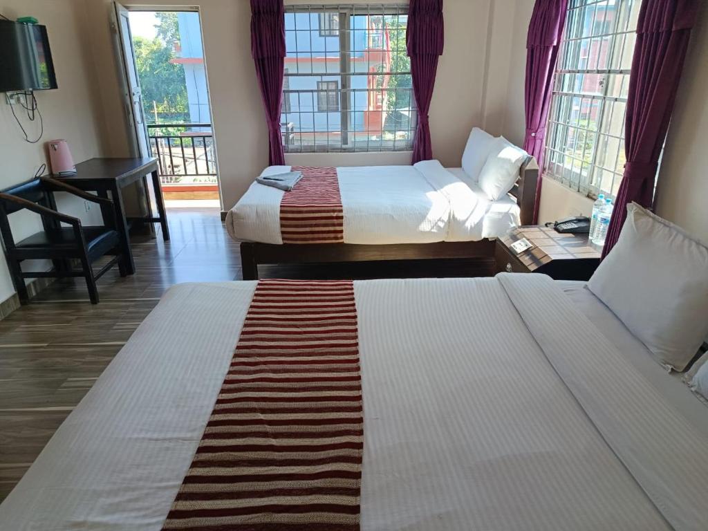 Postel nebo postele na pokoji v ubytování Hotel crystal fall