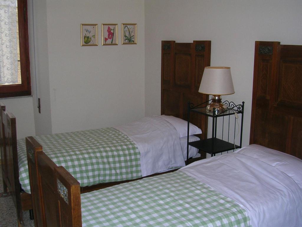 A bed or beds in a room at Ascoli Antica B&B