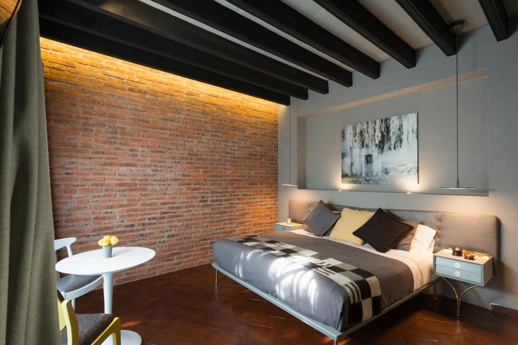 Postel nebo postele na pokoji v ubytování Dos Casas Hotel & Spa