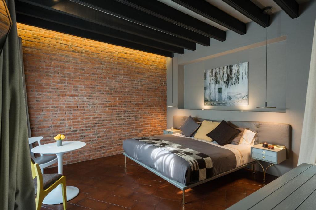 Postel nebo postele na pokoji v ubytování Dos Casas Hotel & Spa