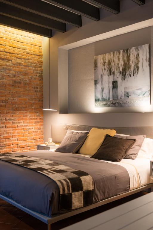 Postel nebo postele na pokoji v ubytování Dos Casas Hotel & Spa