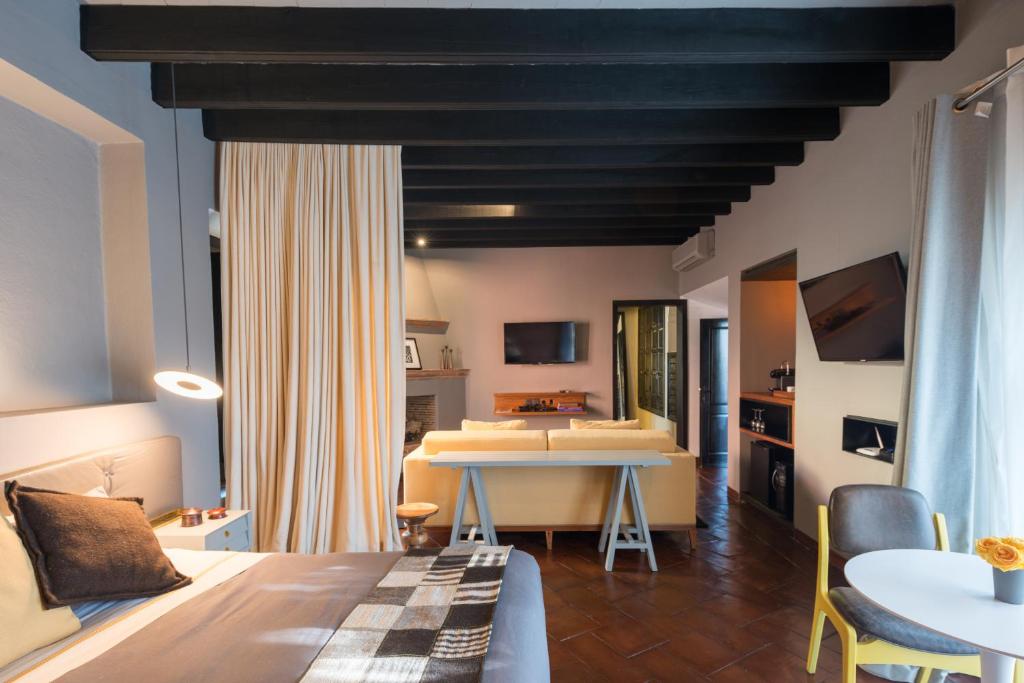 Postel nebo postele na pokoji v ubytování Dos Casas Hotel & Spa