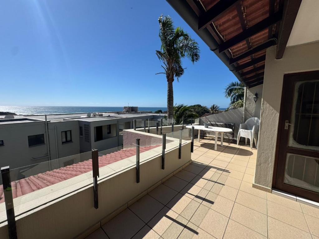 a view of the beach from the balcony of a house at Cicada 8 in Ramsgate