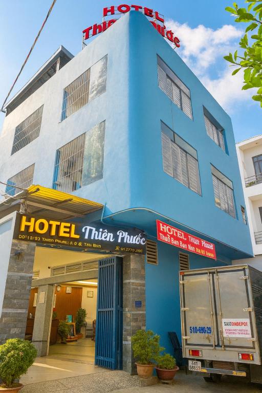 a blue hotel with a hotel titan philips at Thiên Phước Hotel in Ho Chi Minh City