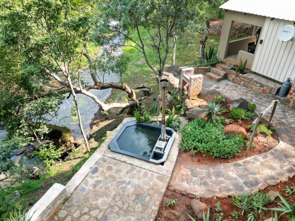 an aerial view of a swimming pool in a garden at Rocky Drift Private Nature Reserve in Waterval Boven